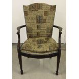 A tapestry design upholstered library chair with cushion