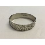 A hallmarked silver bangle, with engraved detail. Birmingham 1935. Approx 28.2g