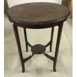 A vintage table with inlaid banding.