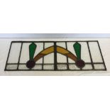 A pair of c1930's stained glass from windows - both right and left handed. Approx 43cm x 31cm