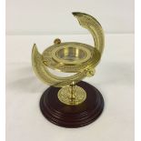 A reproduction brass compass. A commemorative piece from 'The Discovery of America' series 1492-