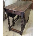 A Georgian/early Victorian oak gateleg table with barley twist legs and drawer one end.106 x 137cm
