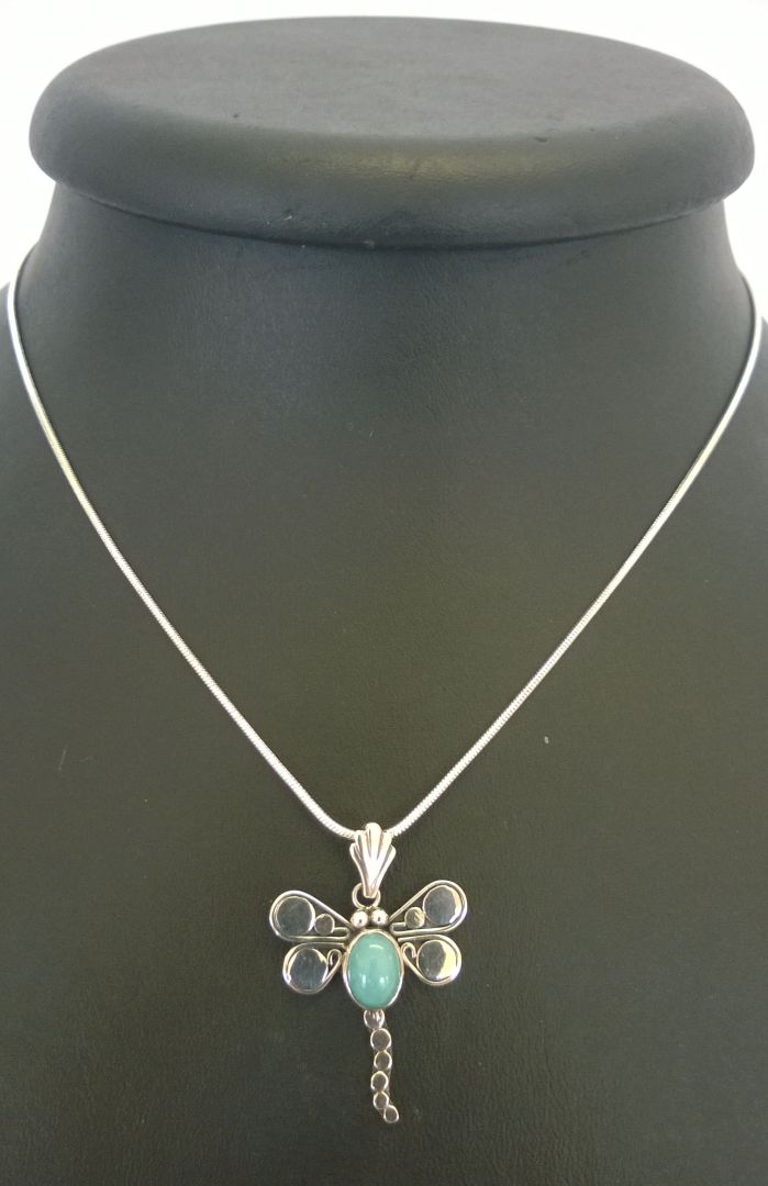 A dragonfly pendant of 925 silver set with an Amazonite cabochon on a rope chain