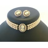 A Lotus simulated pearl choker necklace, 3 strand set with a blue cameo & matching cameo earrings (