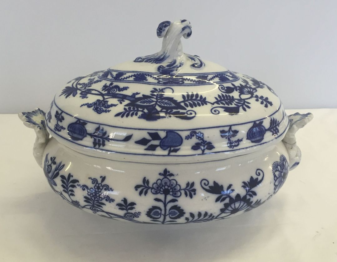 A large blue and white lidded tureen by Cauldon, Meissen onion pattern. Repair to handle.