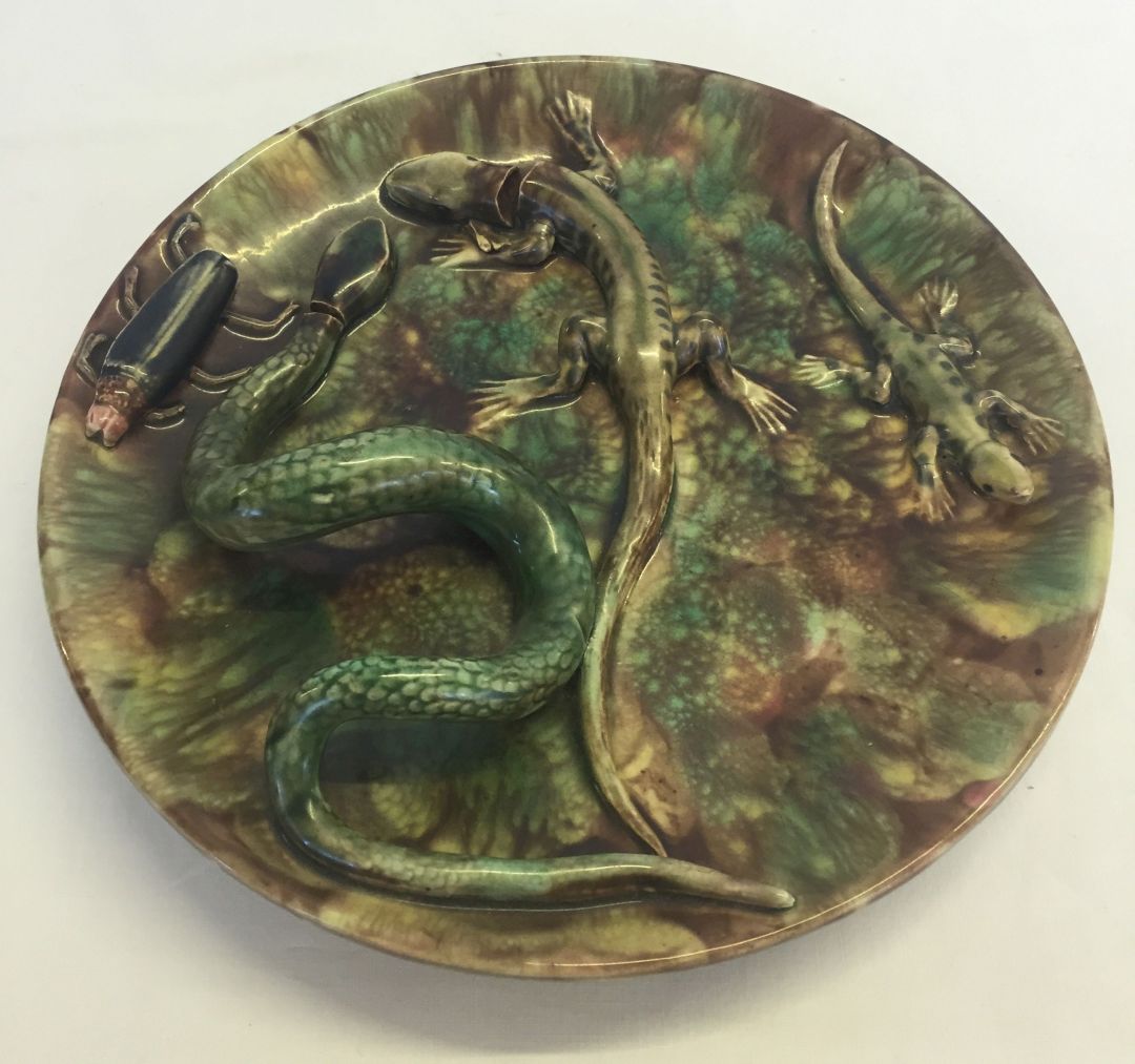 Antique Majolica dish with snake and insect decoration. Some firing faults, approx 23cm diameter