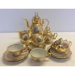 A German Schlottenhof Bavarian gilded coffee set comprising coffee pot, sugar bowl, milk jug and 6