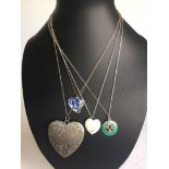 4 costume pendants on silver chains. 1 enamelled, 3 heart shaped.