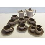 A Poole breakfast set comprising coffee pot, water pot, 6 coffee cups and saucers, sugar bowl & 4