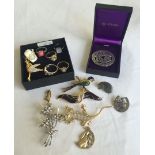 A collection of costume jewellery to include a St Justin celtic design pewter brooch in it's