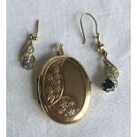 An oval 9ct gold locket together with 2 gold earrings set with stones. Total weight approx 5.5g