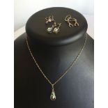 A silver aurora borealis drop pendant on silver chain with matching earring, together with 2 pairs