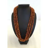 A 24 inch long necklace of amber chips.