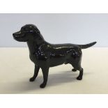 A Beswick black Labrador dog figurine approx 21cm long.