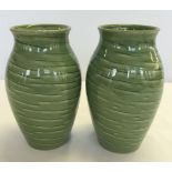 A pair of Langley pottery green glaze vases.