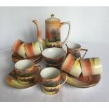 A Noritake coffee set with grazing sheep decoration, comprising; 6 coffee cups & saucers, cream jug,