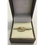 An antique gold and diamond ring set with 9 diamonds, Hallmark rubbed, tests as 18ct gold size J.