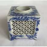 A blue and white square ceramic inkwell with pierced work sides. Approx 10cm high.