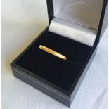 A 22ct gold wedding band size M, approx weight 2.1g.