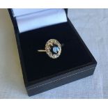 An 18ct gold sapphire and diamond dress ring. Some wear to sapphire stone, size P. Total approx.