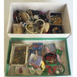 A box of costume jewellery, together with a tray of collectors pin badges and charity rubber
