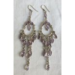 Pair of large silver drop earrings set with amethysts.