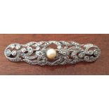 A 925 silver bar brooch decorated with marcasite and central cultured pearl.