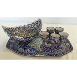 A Persian enamelled metal tray, bowl (a/f) and 5 small cups. Tray is approx 33cm long. Damage to