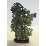 A large jade carving of a column with entwined flowers, gourds, birds & animals. 31.5cm tall (exc