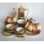 A Noritake coffee set with grazing sheep decoration, comprising; 6 coffee cups & saucers, cream ...