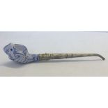 A blue and white elephants head opium pipe.