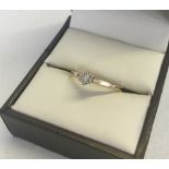 A 9ct gold diamond illusion set solitaire diamond ring. Size P total weight 1.1g.