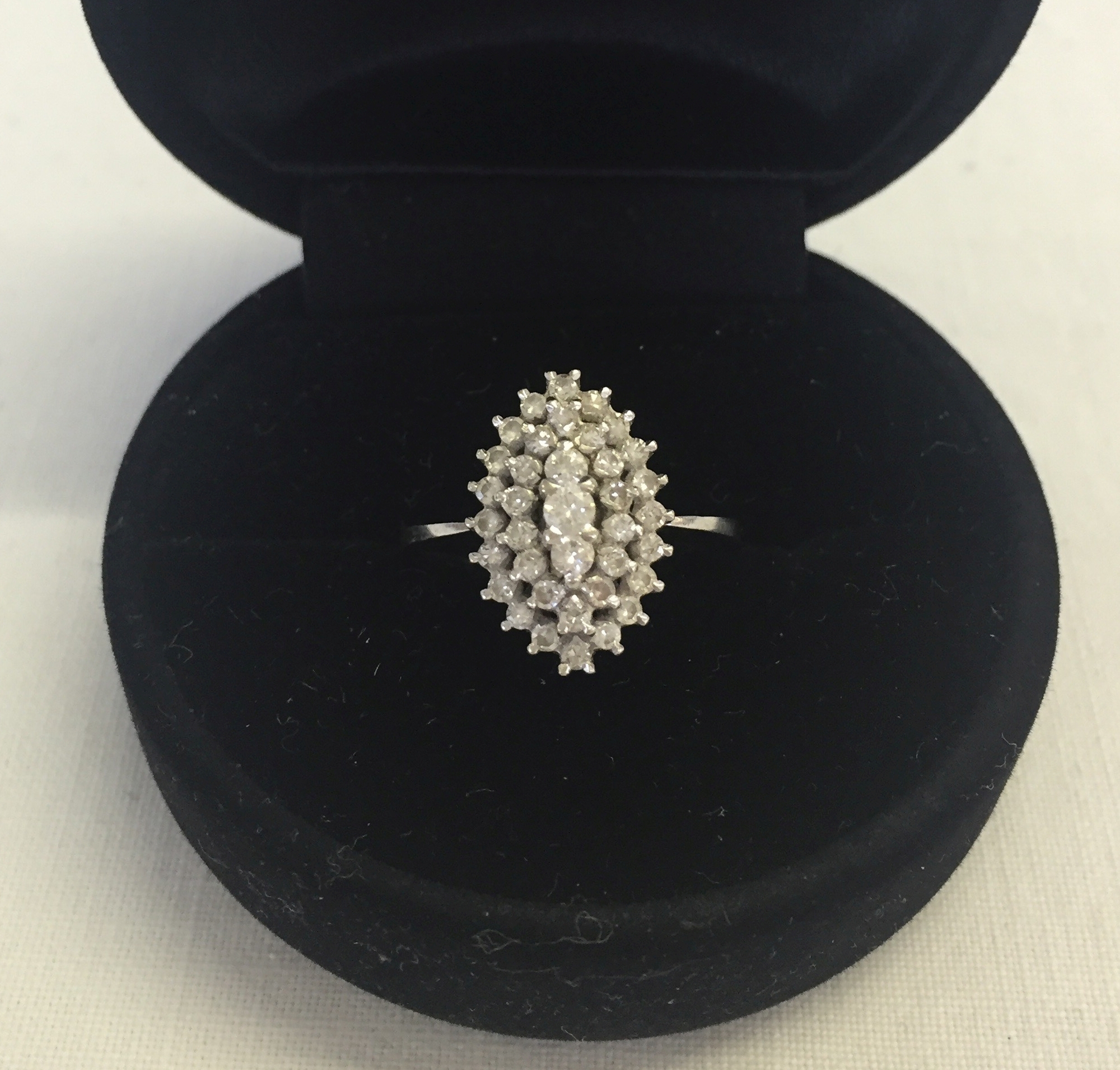 An 18ct white gold & diamond marquise shaped cluster ring. Size M 1/2. Approx weight 3.4g. Tests