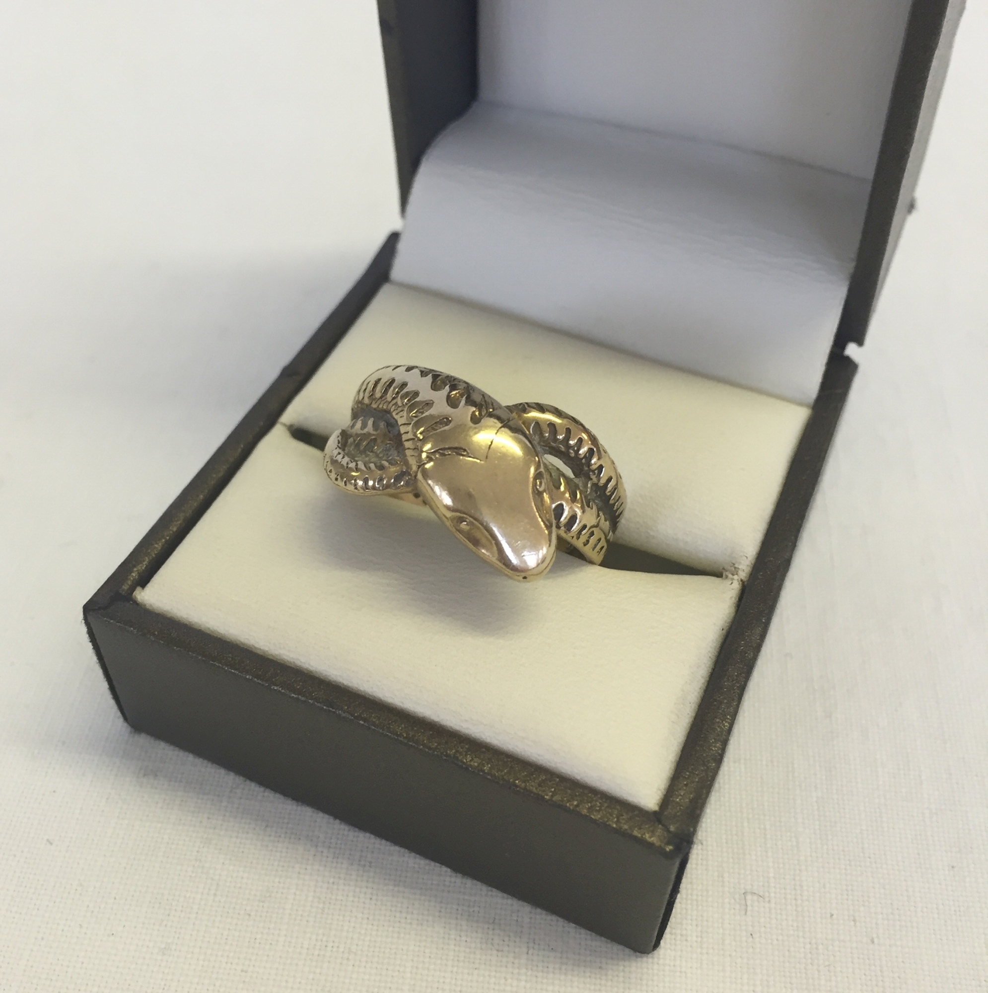 A 9ct gold single head serpent ring size U1/2 approx weight 7g.
