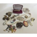 A box of costume jewellery to include a string of faux pearls with gilded silver clasp.