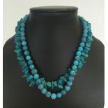 2 turquoise necklaces both 16". One string with round beads and the other with chips.