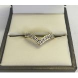 9ct gold wishbone ring set with cubic zirconias size P, total weight 2.1g.