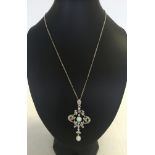 An Art Nouveau style opal & crystal pendant set in silver on a silver chain.