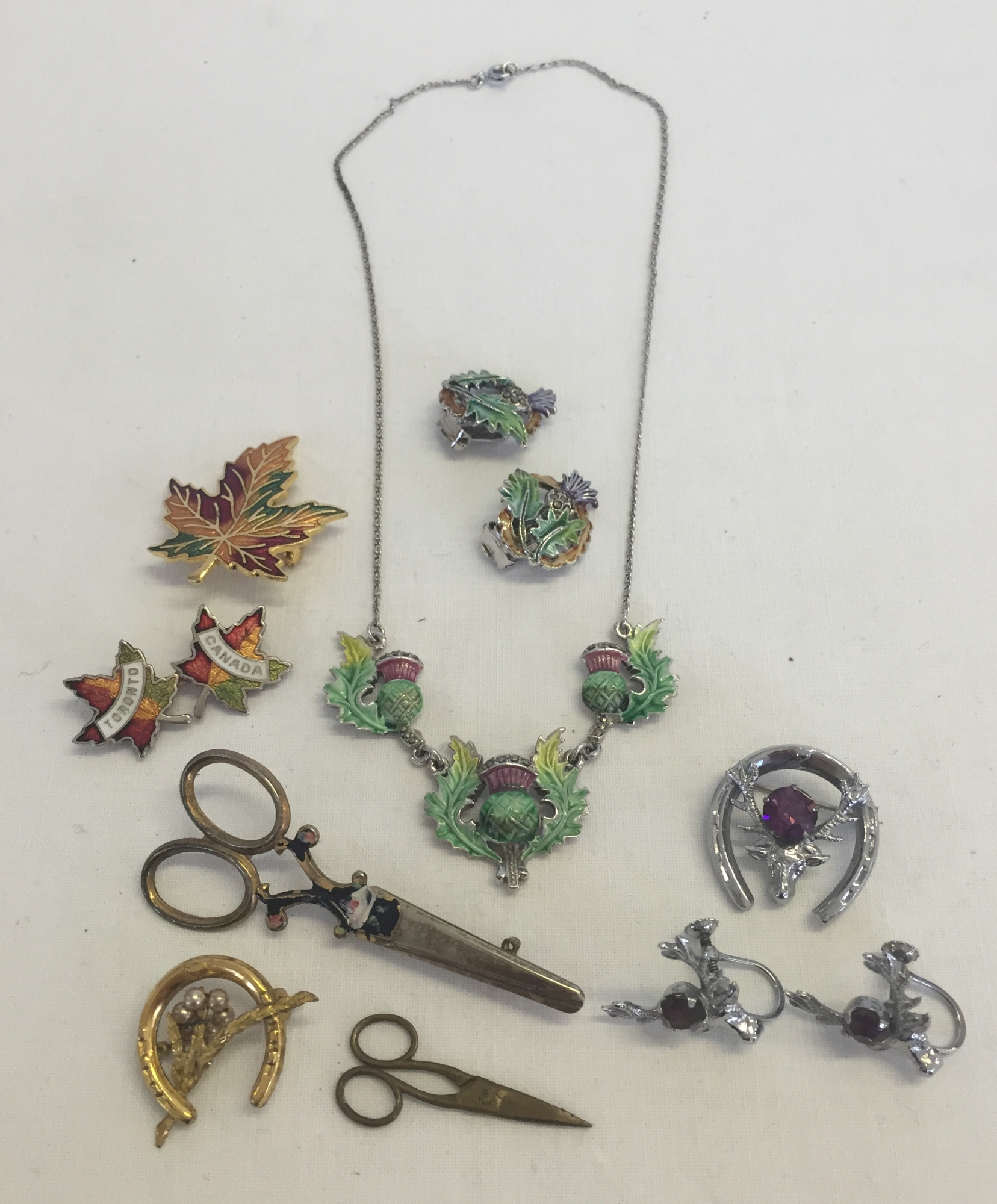 A small quantity of costume jewellery to include Mizpah matching brooch and earrings with stag