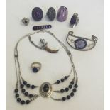 A collection of costume jewellery to include silver necklace, brooch and rings.