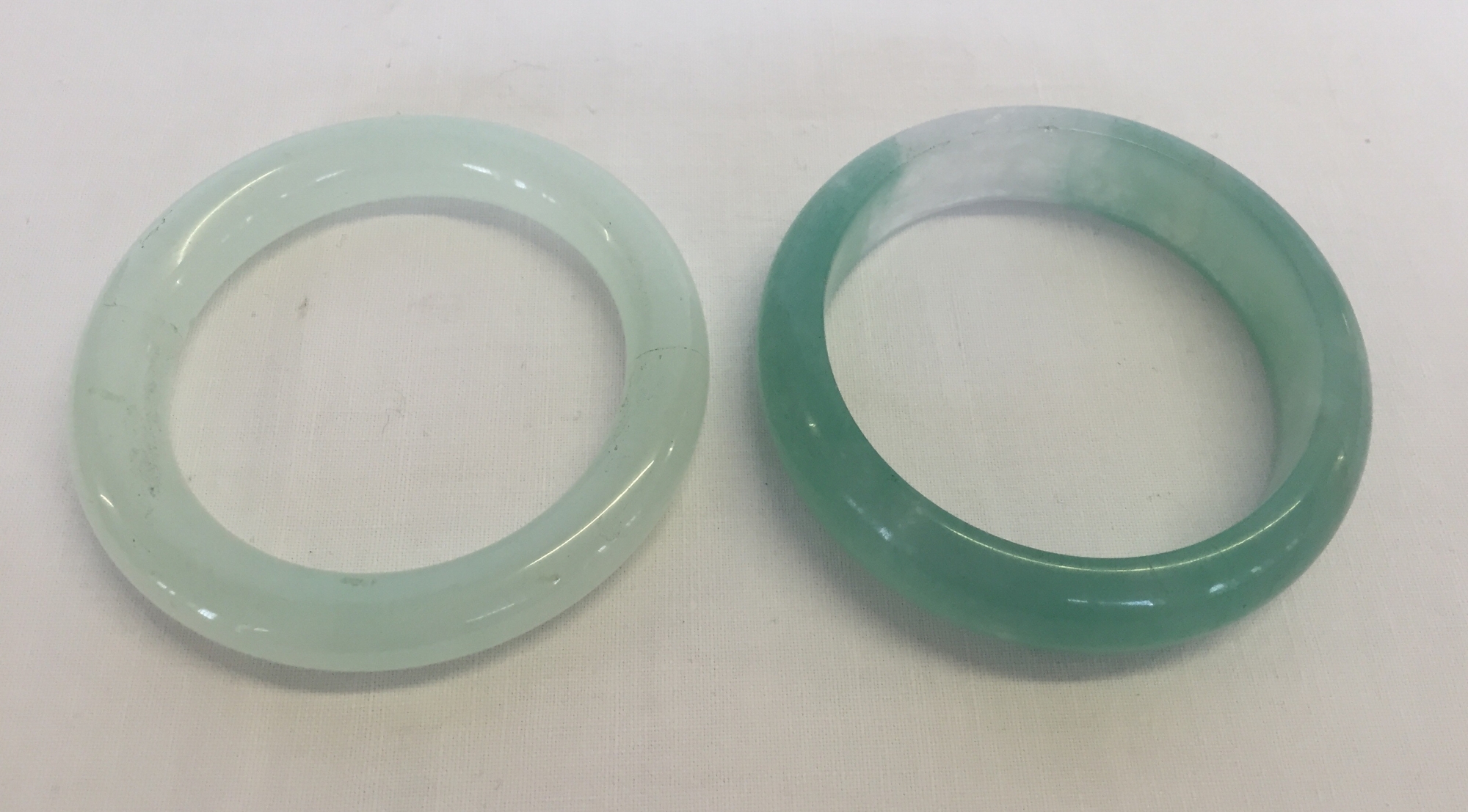 2 Jade bangles approx 8cm diameter