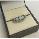 An 18ct gold & opal ring. Set with 5 opals. Size M. Total approx weight 3.6g.