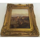 A gilt framed porceline plaque depicting a continental 18th century scene. Frame size approx 32 x