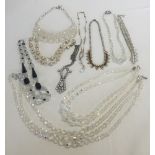 A collection of 10 vintage aurora borealis glass bead and diamante necklaces.