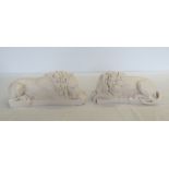 A pair of white marble laying lions. Approx 32 x 13cm.