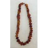 An 18 inch Amber necklace - irregular shaped stones. Weight approx 44.3g