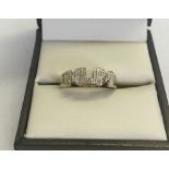 A 9ct gold "Mum" ring. Illusion set with 3 small diamonds. Size M total weight 1.3g.