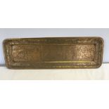 A 19th century brass tray probably Indian/Tibetan with Chinese influence. 61 x 20cm. Red & blue