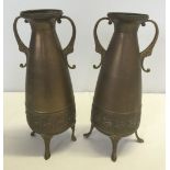 A pair of brass vases on legs by C.K. Tiel and Co, Holland.