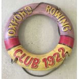 A painted modern lifebuoy ring with rope. Reads " Oxford rowing club 1922 ". Approx 75cm diameter.